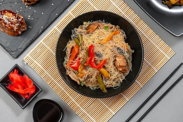 Food asian cuisine asian or szechuan noodles chinese wok noodles in a bowl with vegetables and teriy