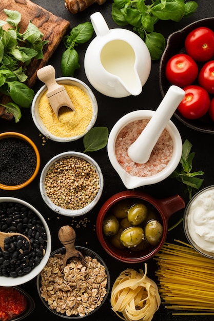 Food background Food Concept with Various Tasty Fresh Ingredients for Cooking. Italian Food Ingredients. View from Above. Cooking Process.