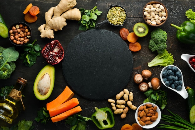 Food background fruits vegetables and berries on the old kitchen table Top view Rustic style