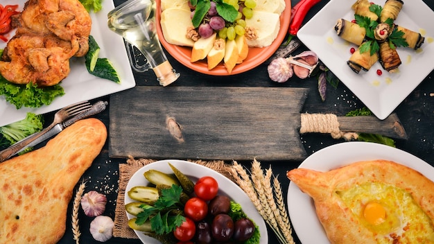 Food Background Georgian cuisine On a black wooden background Free space for text Top view