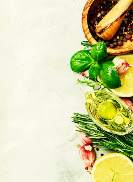 Food background spices herbs olive oil and seasonings top view