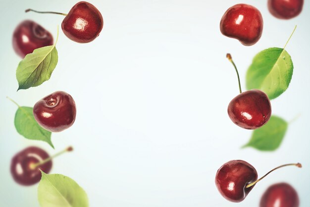 Food background with flying cherries