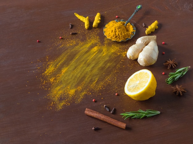food background with turmeric, cinnamon,ginger, lemon and pepper. prevention of antiviral infections