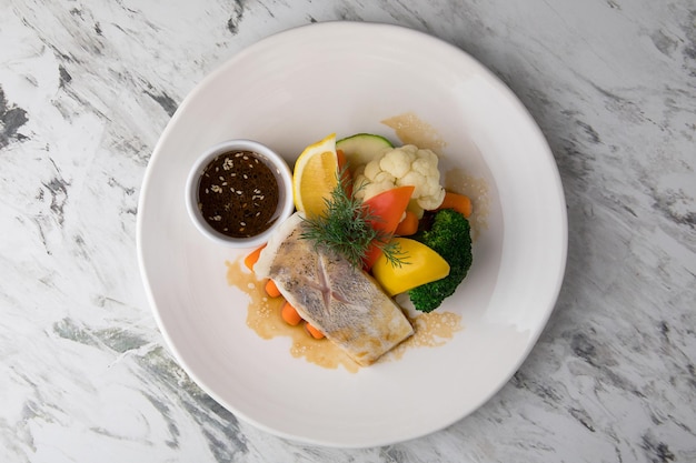 Food banner of meat cut into strips lemon and meal on a white plate