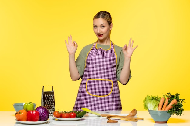 Food blogger cute fitness cook recording video for social media showing ok gesture