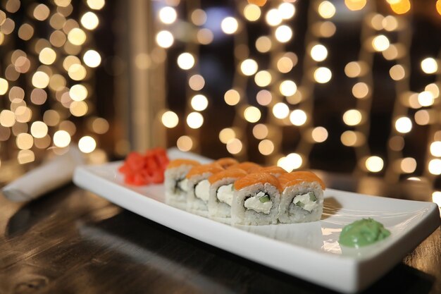 Food in the cafe on the table Japanese sushi and tea