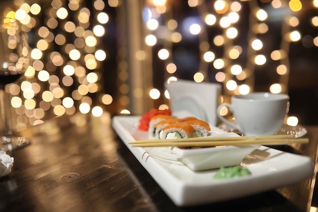 Food in the cafe on the table Japanese sushi and tea