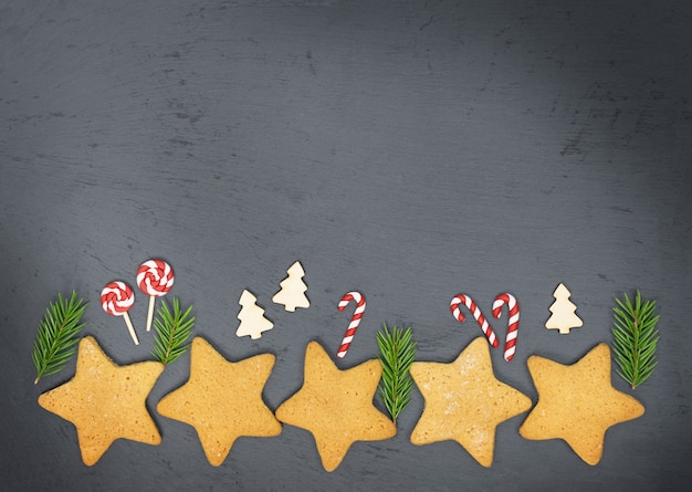 Food Christmas background with Christmas gingerbread cookies on a concrete backdrop