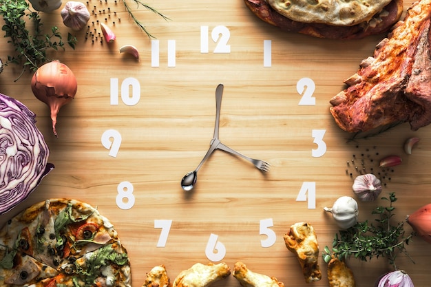 Food clock on the Light wood.