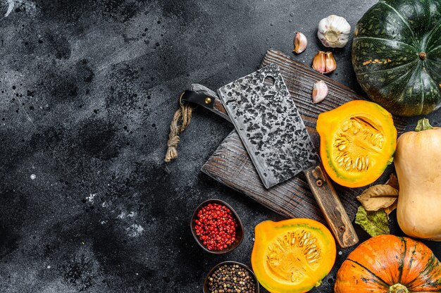 Food composition with pumpkins, cleaver and cutting board