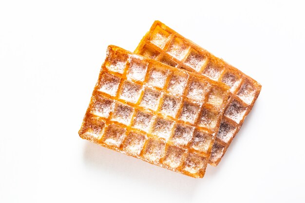 Food concept Classic square Waffles with icing sugat toping on white background 