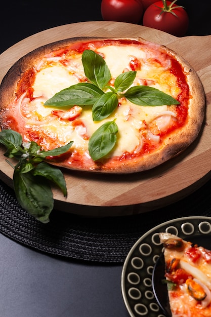 Food concept Homemade Tortilla Margherita pizza on wood board
