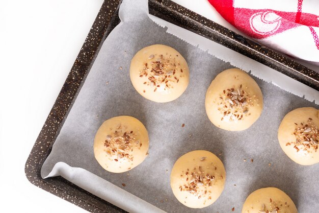 Food concept Proving, Proofing yeast dough of hamburger buns in bake pan before baking 