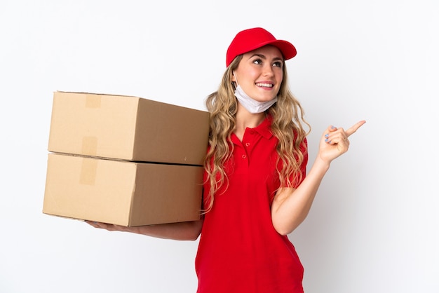 Food delivery Brazilian woman isolated on white background pointing up a great idea