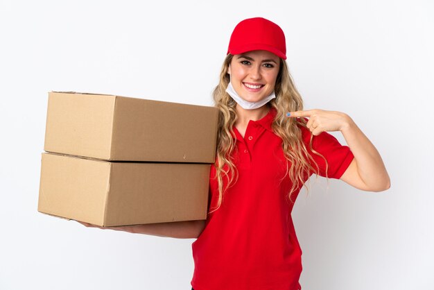 Food delivery Brazilian woman isolated on white giving a thumbs up gesture