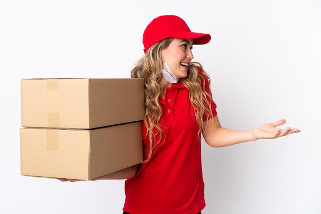 Food delivery Brazilian woman isolated on white with surprise expression while looking side