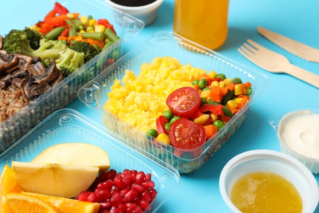 Food delivery. Food in takeaway boxes on blue background