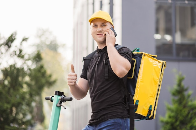 Food delivery guy with yellow backpack deliver orders