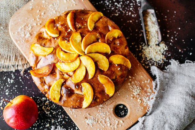 Food, dessert, pastries, pie. Tasty beautiful apple pie on a concrete background