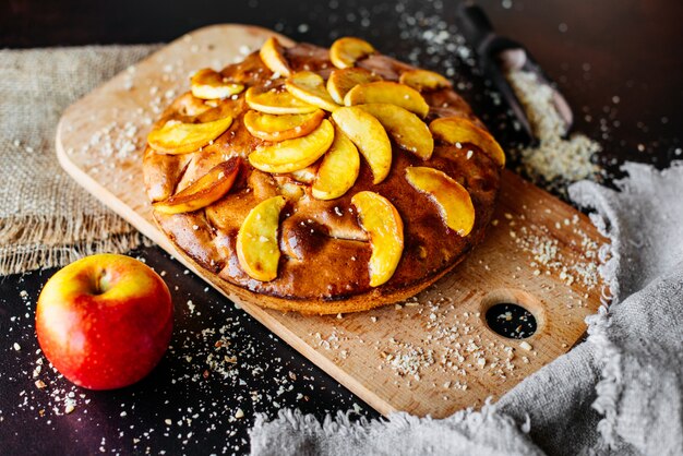 Food, dessert, pastries, pie. Tasty beautiful apple pie on a concrete background