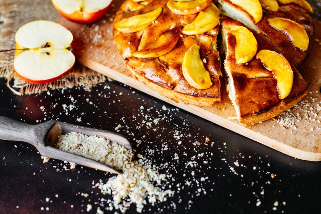 Food, dessert, pastries, pie. Tasty beautiful apple pie on a concrete background