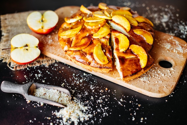 Food, dessert, pastries, pie. Tasty beautiful apple pie on a concrete background