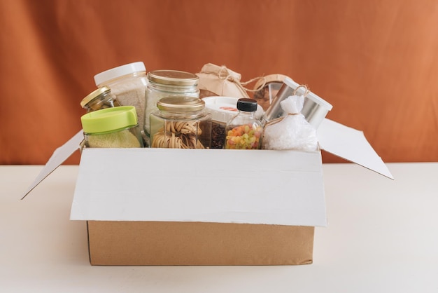 Food donations box isolated on table