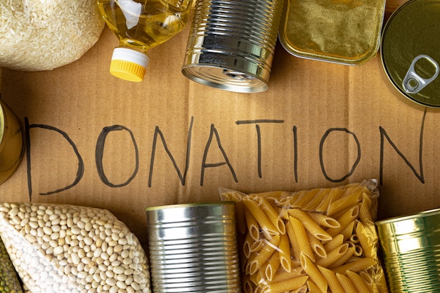 Food donations on the table. Text Donation. Close up.