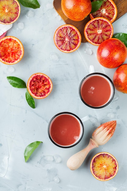 Food and drink health care diet and nutrition concept Fresh red blood orange juice from ripe organic citrus fruits in a bottle for breakfast on a kitchen table Spring summer beverage