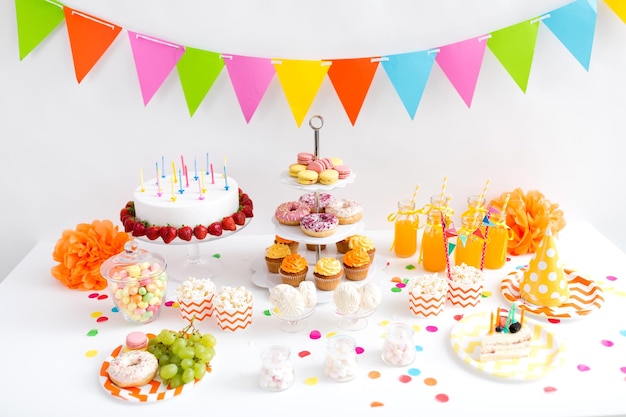 Photo food and drinks on table at birthday party