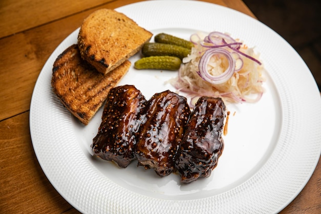 Food Grilled Meat And Vegetables With Sauce Closeup Grilles Pork Ribs In Restaurant