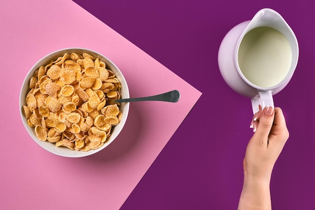 Food healthy eating people and diet concept close up of woman eating muesli with milk for breakfast