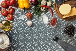 Foto food ingredients and spices for cooking pizza mushrooms tomatoes cheese onion oil pepper salt egg grater on metal background copy space top view