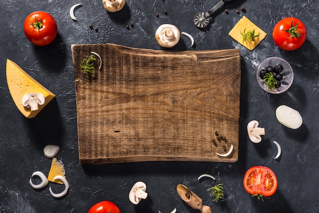 Photo food ingredients and spices near a cutting board