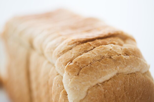 food, junk-food and unhealthy eating concept - close up of white toast bread