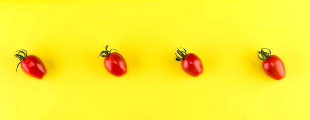 Food pattern of cherry tomato isolated on yellow background Flat lay top view