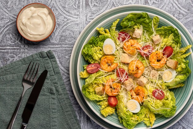 Food photography of caesar salad with prawn and sauce