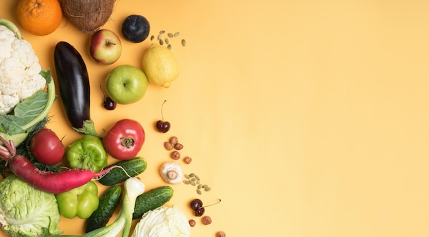 Photo food photography different fruits and vegetables isolated yellow background copy space