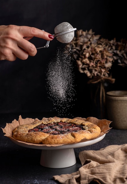 Food photography of galette with figs and icing sugar