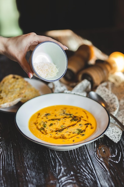 Food photography. Gazpacho on a dark wood background