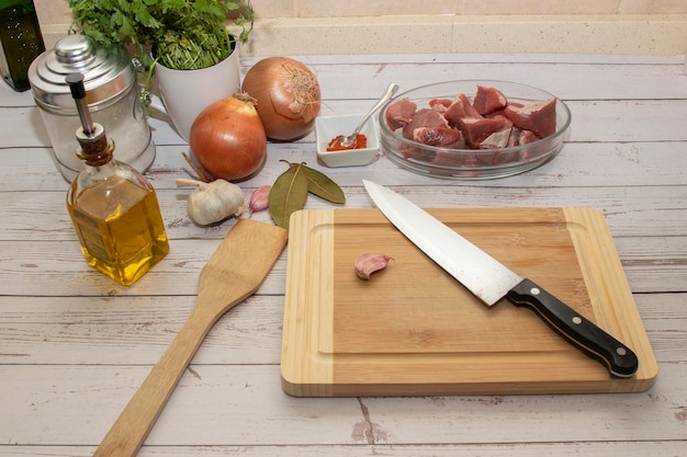 Food preparation for making goulash All on top of a wooden table top view