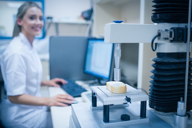 Food scientist using technology to analyse bread