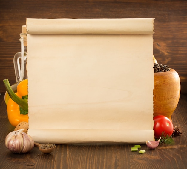 Food spice and old paper on wooden