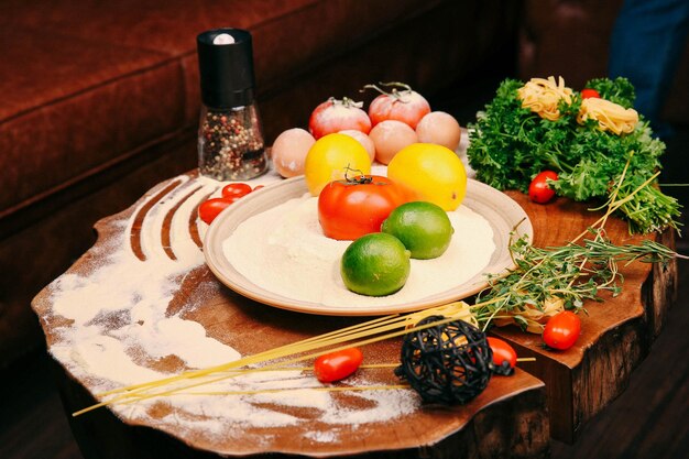 Food Styling Freshly vegetables, flour and spices on the table, cook.