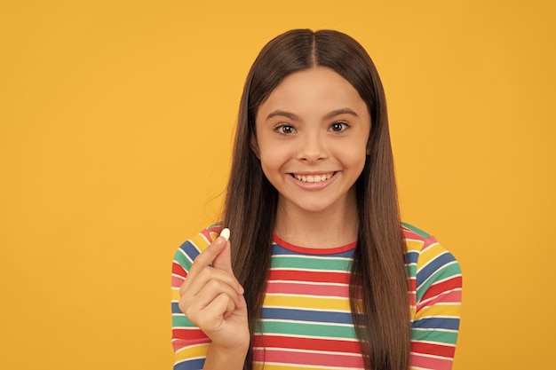 Food supplement girl with natural pill products presenting vitamin product