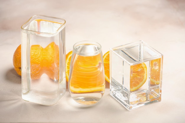 Foods distorted through liquid and glass on light background