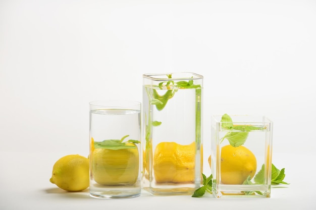 Foods distorted through liquid and glass on white background