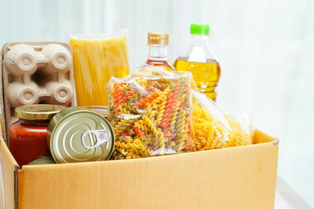 Foodstuffs in donation box for volunteer to help people