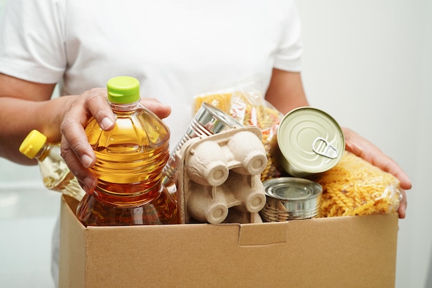 Foodstuffs in donation box for volunteer to help people