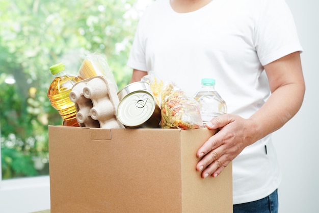 Foodstuffs in donation box for volunteer to help people